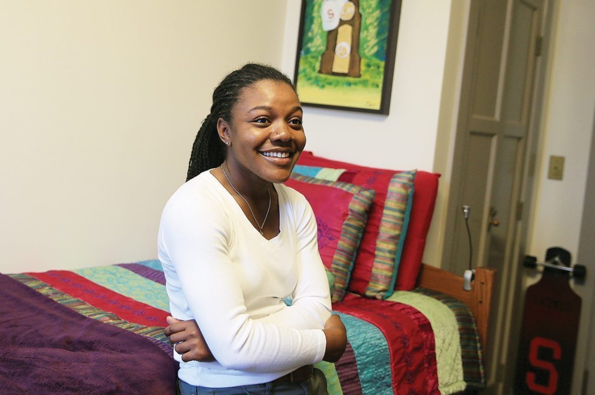 Mariah Stackhouse in her dorm at Stanford. The painting behind her is from a team bonding activity prior to winning the National Championship.