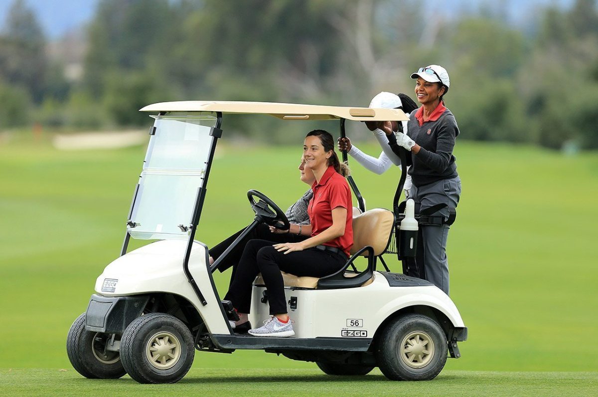 Former Secretary of State, Condoleezza Rice and Stanford golf team's Mariah Stackhouse hitch a ride from head coach, Anne Walker on campus recently.