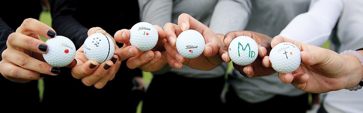 Stanford women's golf team show how they uniquely mark their golf balls.
