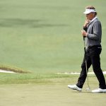 Bernhard Langer reacts on the second green during the final round of the 2016 Masters Tournament at Augusta National Golf Club.