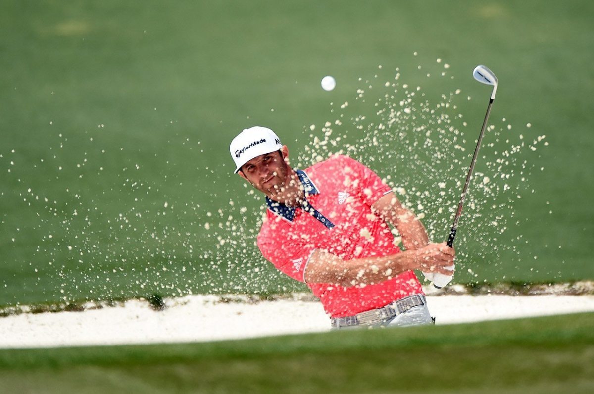Dustin Johnson plays a shot from a bunker on the second hole during the final round of the 2016 Masters Tournament at Augusta National Golf Club.