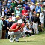 Dustin Johnson lines up a putt on the second green during the final round of the 2016 Masters Tournament at Augusta National Golf Club.