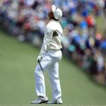 Hideki Matsuyama reacts on the first hole during the final round of the 2016 Masters Tournament at Augusta National Golf Club.
