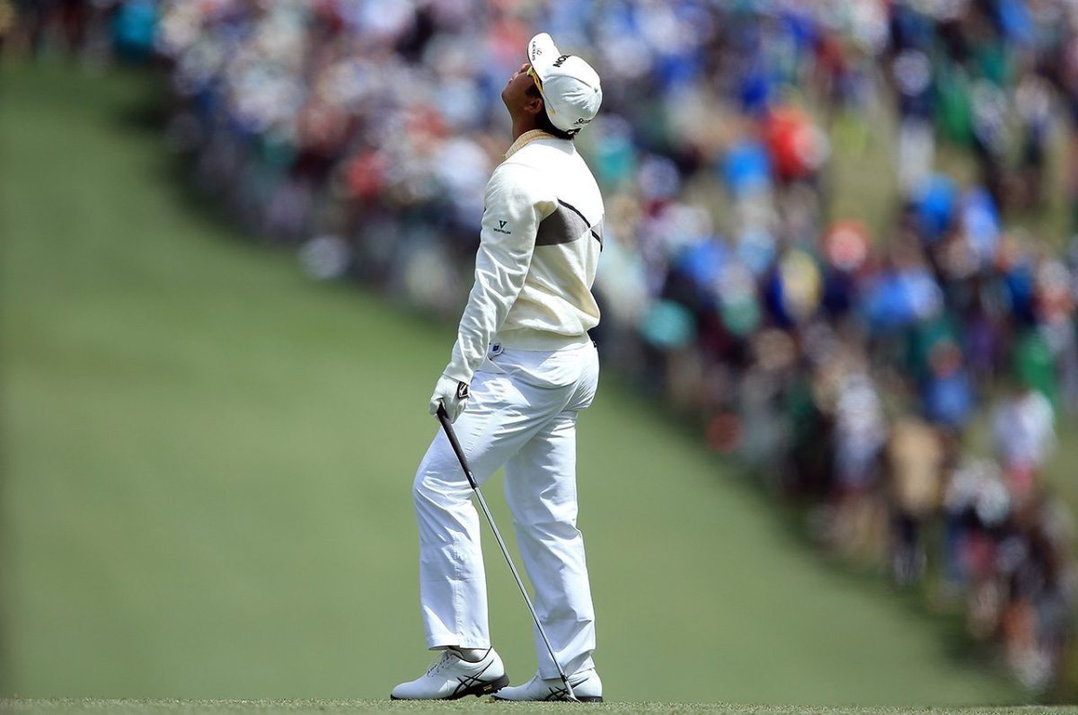 Hideki Matsuyama reacts on the first hole during the final round of the 2016 Masters Tournament at Augusta National Golf Club.