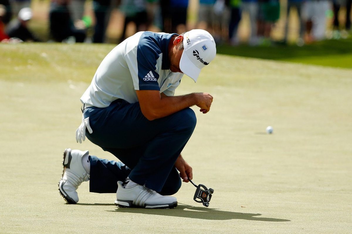Jason Day reacts to a missed birdie putt on the seventh green during the final round of the 2016 Masters Tournament at Augusta National Golf Club.