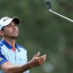 Jason Day tosses his club in the air after playing his second shot on the 14th hole during the first round of the 2016 Masters Tournament at Augusta National Golf Club.