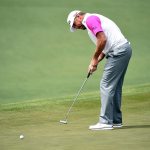 Lee Westwood putts on the second green during the final round of the 2016 Masters Tournament at Augusta National Golf Club.