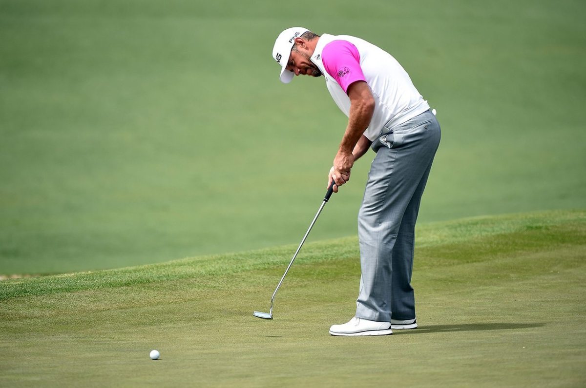 Lee Westwood putts on the second green during the final round of the 2016 Masters Tournament at Augusta National Golf Club.