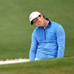 Rory McIlroy reacts to his shot from the bunker on the second hole during the final round of the 2016 Masters Tournament at Augusta National Golf Club.