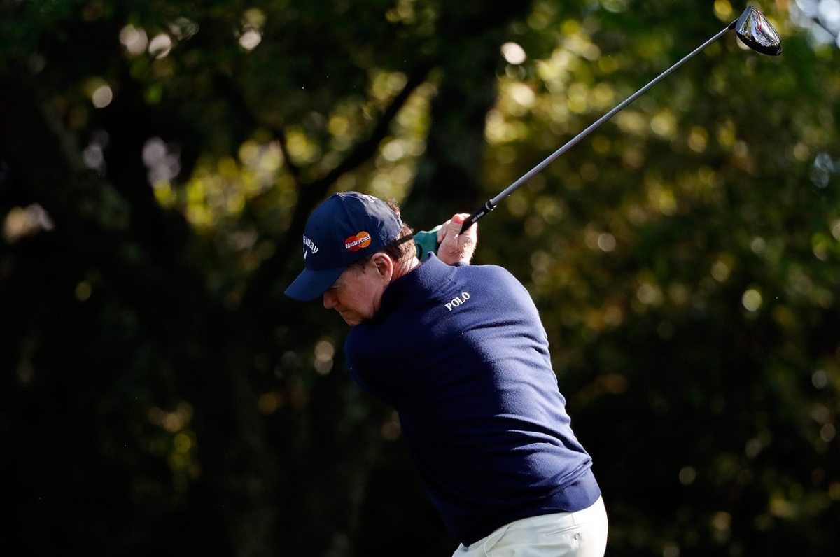Tom Watson takes a practice swing on the second hole during the first round of the 2016 Masters Tournament at Augusta National Golf Club.