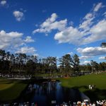 Shane Lowry and J.B. Holmes prepare to play a shot on the 15th hole during the first round of the 2016 Masters Tournament at Augusta National Golf Club.
