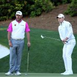 Lee Westwood and Danny Willett react on the 13th green during the final round of the 2016 Masters Tournament at Augusta National Golf Club.