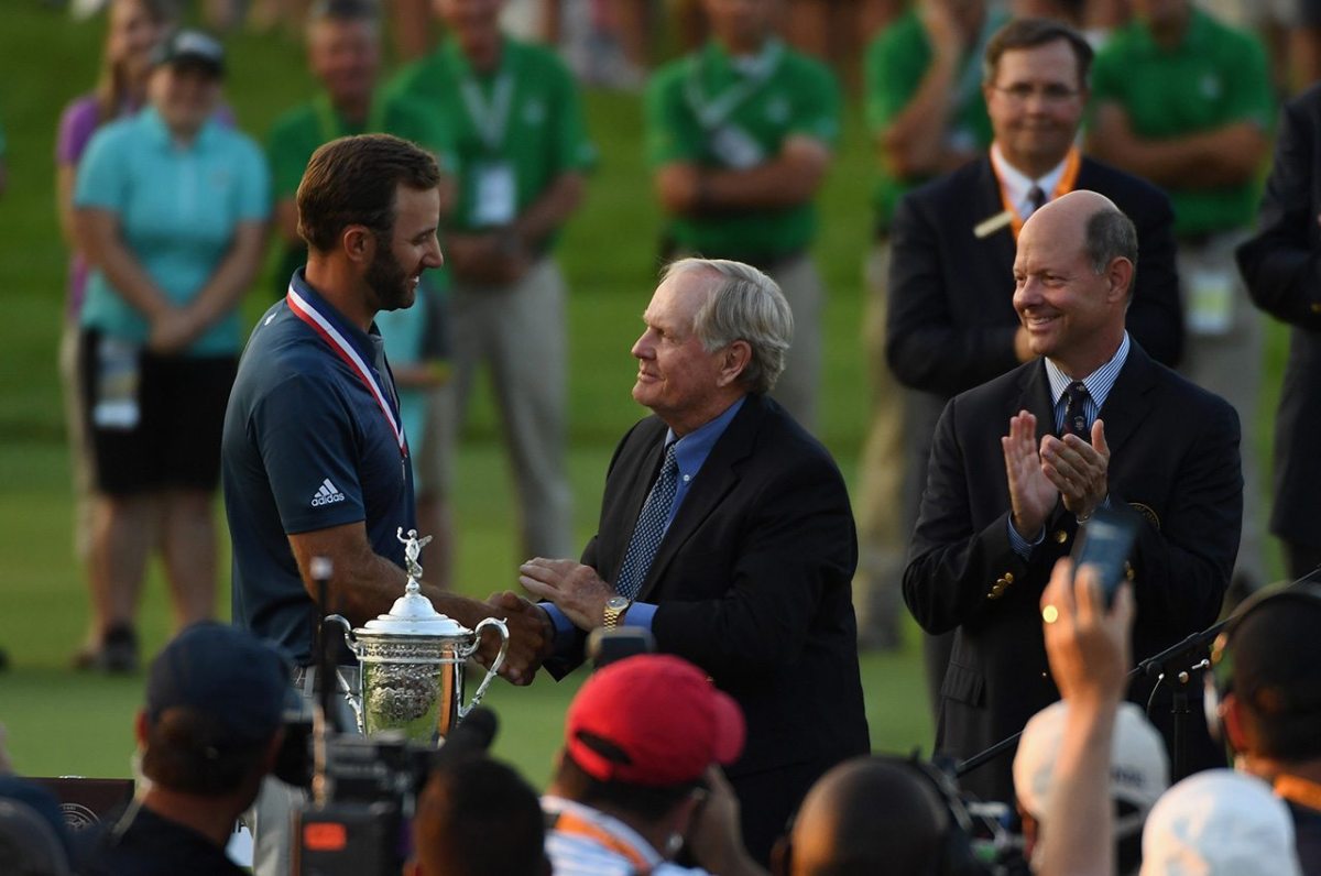 OAKMONT, PA - JUNE 19: Dustin Johnson of the United States celebrates alongside Jack Nicklaus after winning the U.S. Open at Oakmont Country Club on June 19, 2016 in Oakmont, Pennsylvania. (Photo by Ross Kinnaird/Getty Images)