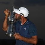 OAKMONT, PA - JUNE 19: Dustin Johnson of the United States kisses the winner's trophy after his victory at the U.S. Open at Oakmont Country Club on June 19, 2016 in Oakmont, Pennsylvania. (Photo by Ross Kinnaird/Getty Images)