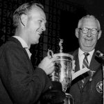 President of the USGA John Clock presents the U.S. Open trophy to Arnold Palmer, left, at the Cherry Hills Country Club in Denver, Colorado on June 18, 1960. (AP Photo)
