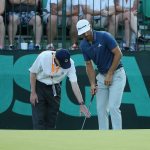OAKMONT, PA - JUNE 19: Dustin Johnson of the United States chats with a rules official behind the 16th green during the final round of the U.S. Open at Oakmont Country Club on June 19, 2016 in Oakmont, Pennsylvania. (Photo by Andrew Redington/Getty Images)