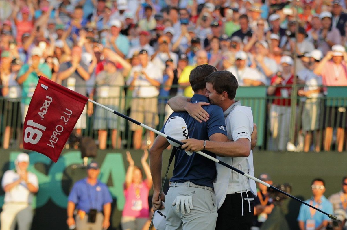 OAKMONT, PA - JUNE 19: Dustin Johnson of the United States celebrates with caddie Austin Johnson after winning the final round of the U.S. Open at Oakmont Country Club on June 19, 2016 in Oakmont, Pennsylvania. (Photo by Sam Greenwood/Getty Images)
