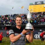 Henrik Stenson poses with the Claret Jug on the 18th green following his victory during the final round of the British Open. (Getty Images)
