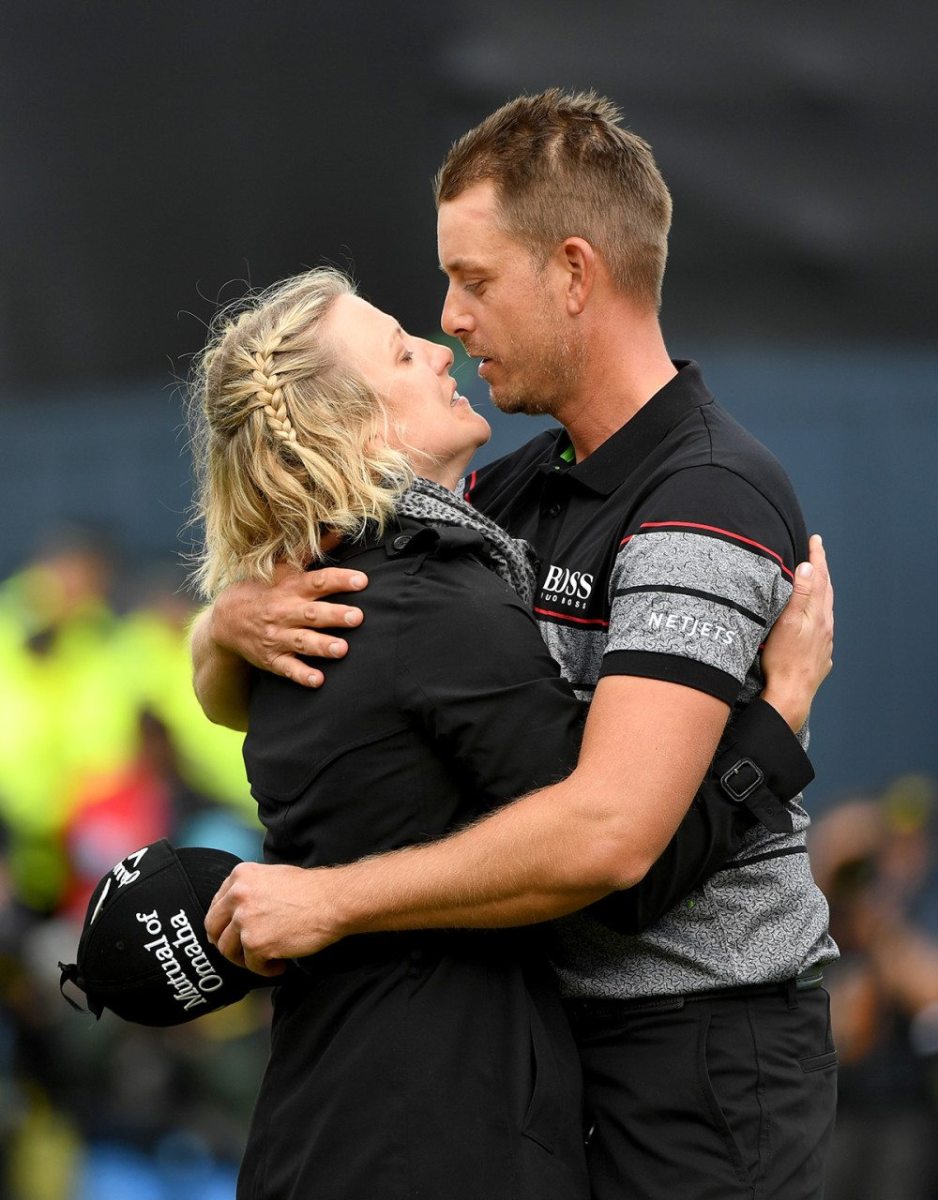Henrik Stenson with wife Emma after holing a putt for victory during the final round of the British Open.