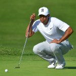 Tiger Woods make up for some issues with his driver by a solid short game and putting play at Torrey Pines. Here, he ponders a putt on the 5th green Saturday. (Donald Miralle/Getty Images)