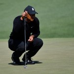 Tiger Woods lines up a putt on the 2nd green. (Michael Madrid-USA TODAY Sports)