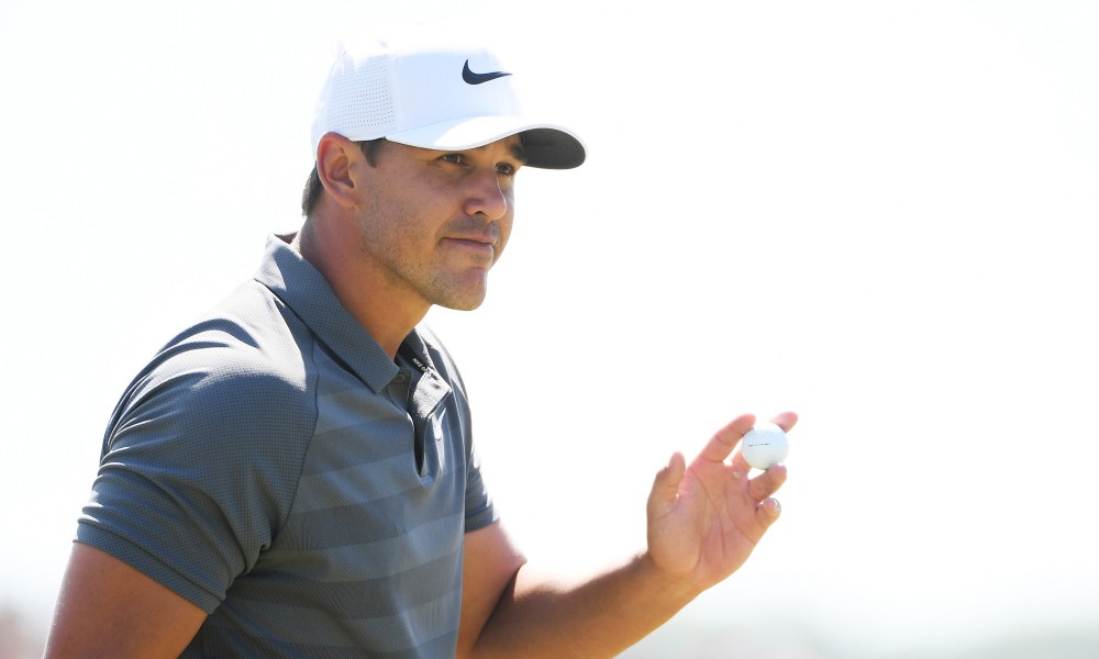 SOUTHAMPTON, NY - JUNE 17: Brooks Koepka of the United States waves from the sixth green during the final round of the 2018 U.S. Open at Shinnecock Hills Golf Club on June 17, 2018 in Southampton, New York. (Photo by Ross Kinnaird/Getty Images)