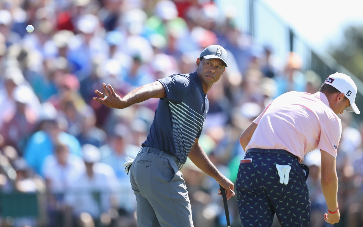 SOUTHAMPTON, NY - JUNE 14: Tiger Woods of the United States tosses his ball to his caddie during the first round of the 2018 U.S. Open at Shinnecock Hills Golf Club on June 14, 2018 in Southampton, New York. (Photo by Warren Little/Getty Images)