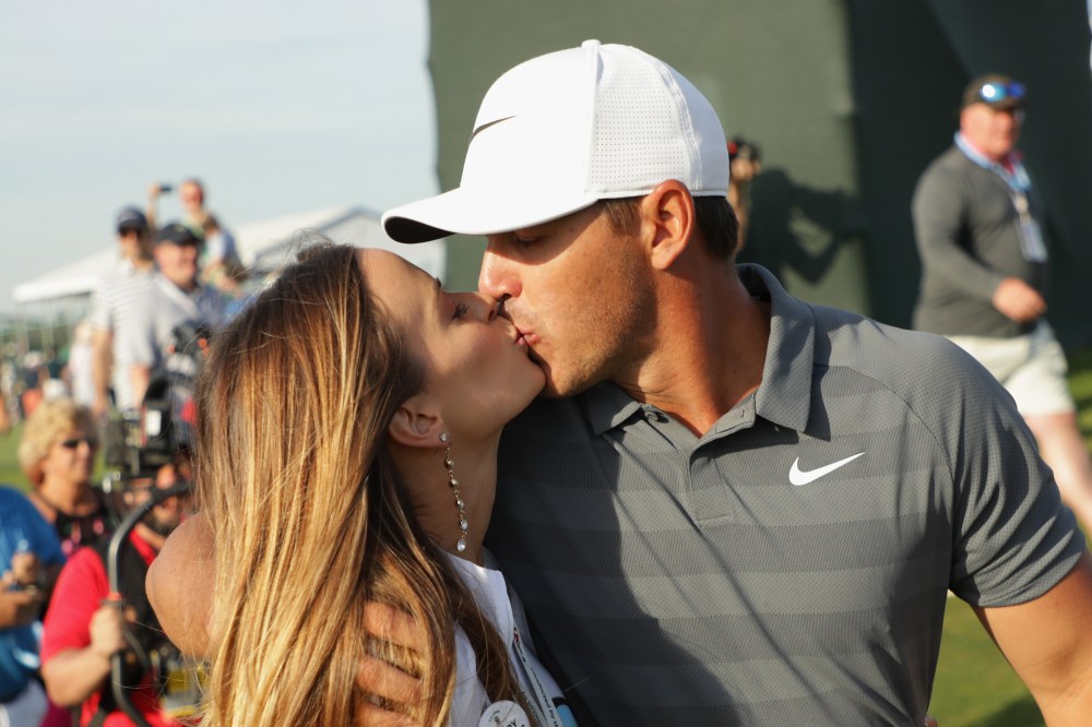 SOUTHAMPTON, NY - JUNE 17: Brooks Koepka of the United States kisses girlfriend Jena Sims as they walk off the 18th green during the final round of the 2018 U.S. Open at Shinnecock Hills Golf Club on June 17, 2018 in Southampton, New York. (Photo by Streeter Lecka/Getty Images)