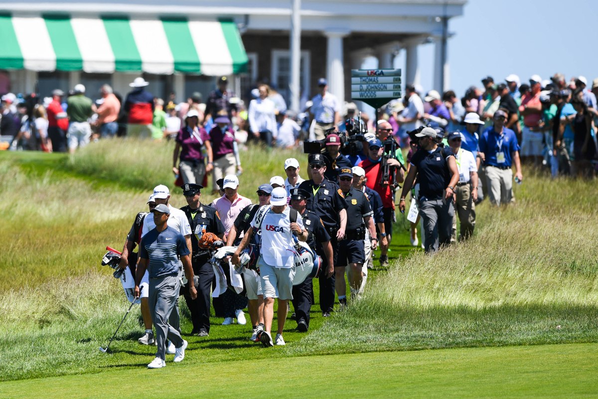 Jun 14, 2018; Southampton, NY, USA; Tiger Woods leads the way to the fairway from the first tee box during the first round of the U.S. Open golf tournament at Shinnecock Hills GC - Shinnecock Hills Golf C. Mandatory Credit: Shanna Lockwood-USA TODAY Sports