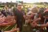 OAKVILLE, ON - JULY 29: Dustin Johnson celebrates his winning putt on the 18th hole by greeting fans Adam Scott of Australia Harris English exits the course during the final round at the RBC Canadian Open at Glen Abbey Golf Club on July 29, 2018 in Oakville, Canada. (Photo by Minas Panagiotakis/Getty Images)