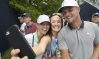 Aug 7, 2018; St. Louis, MO, USA; Bryson DeChambeau takes a selfie with golf fans off the 10th tee box during Tuesdays practice round of the PGA Championship golf tournament at Bellerive Country Club. Mandatory Credit: John David Mercer-USA TODAY Sports