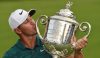 Aug 12, 2018; Saint Louis, MO, USA; Brooks Koepka celebrates with the Wanamaker Trophy after winning the PGA Championship golf tournament at Bellerive Country Club. Mandatory Credit: John David Mercer-USA TODAY Sports