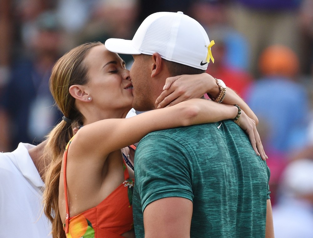 Aug 12, 2018; Saint Louis, MO, USA; Brooks Koepka kisses his girlfriend Jena Sims after winning the PGA Championship golf tournament at Bellerive Country Club. Mandatory Credit: John David Mercer-USA TODAY Sports