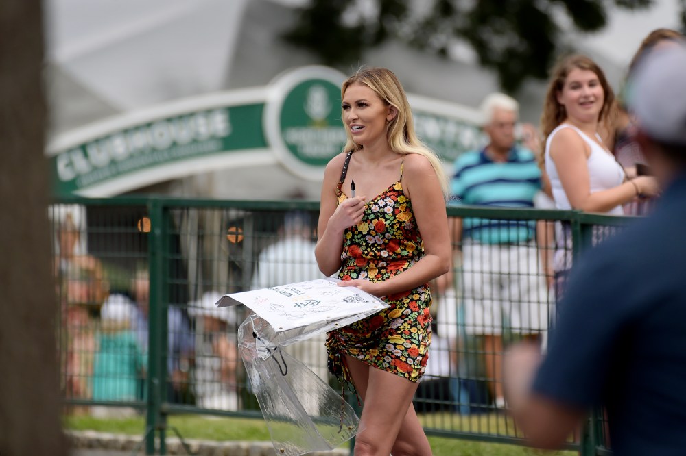 PARAMUS, NJ - AUGUST 26: Dustin Johnson's girlfriend, Paulina Gretzky carries a signed pin flag for a fan during the final round of THE NORTHERN TRUST at Ridgewood Country Club on August 26, 2018 in Paramus, New Jersey. (Photo by Tracy Wilcox/PGA TOUR)