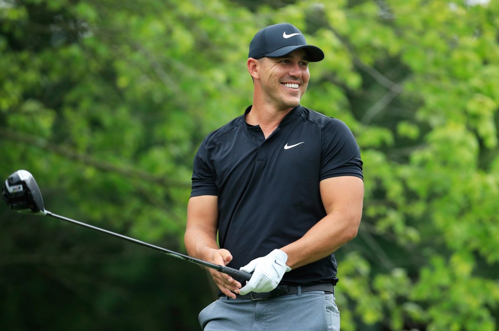 ST. LOUIS, MO - AUGUST 07: Brooks Koepka of the United States smiles after playing a shot during a practice round prior to the 2018 PGA Championship at Bellerive Country Club on August 7, 2018 in St. Louis, Missouri. (Photo by Andy Lyons/Getty Images)