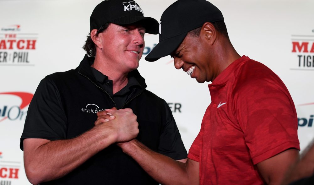 LAS VEGAS, NV - NOVEMBER 20: (L-R) Phil Mickelson and Tiger Woods shake hands during a press conference before The Match at Shadow Creek Golf Course on November 20, 2018 in Las Vegas, Nevada. (Photo by Harry How/Getty Images for The Match)