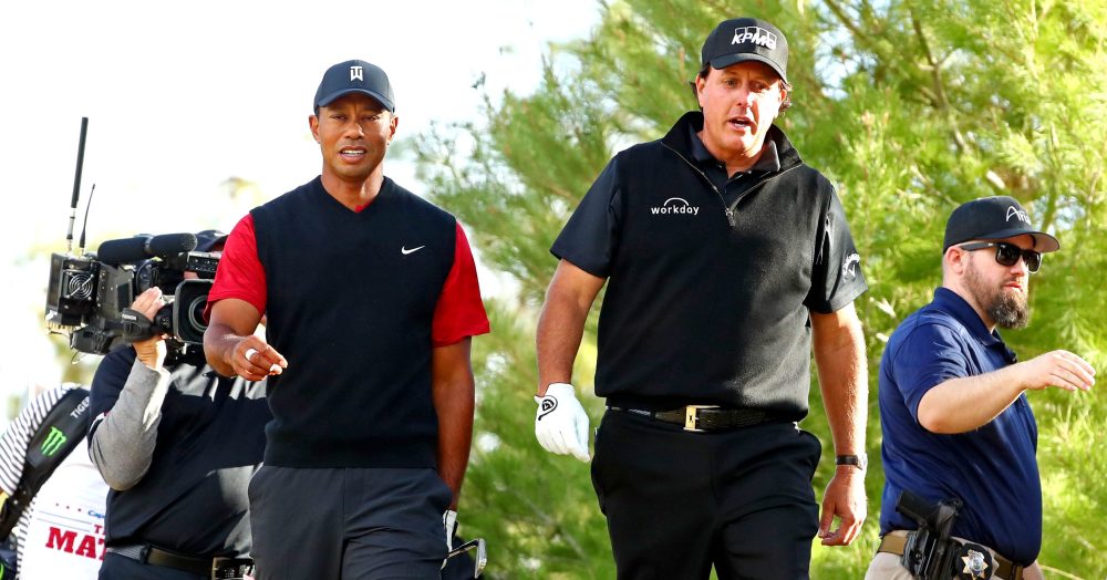 Nov 23, 2018; Las Vegas, NV, USA; Tiger Woods and Phil Mickelson walk off the ninth tee during The Match: Tiger vs Phil golf match at Shadow Creek Golf Course. Mandatory Credit: Kyle Terada-USA TODAY Sports
