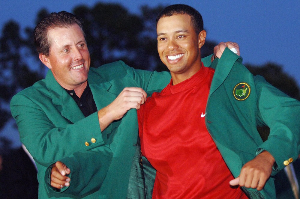 Tiger Woods' preferred Masters wardrobe includes the famed green jacket. He has four, including this one given to him by Phil Mickelson in 2005. (Roberto Schmidt/Getty Images)