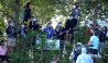Patrick Reed tosses a ball to fans alongside the golf course fence line during the second round of the U.S. Open at Winged Foot Golf Club - West