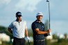 Max Homa plays his shot from the tenth tee as Kevin Tway looks on during the first round of the Bermuda Championship at Port Royal Golf Course on October 29, 2020 in Southampton, Bermuda