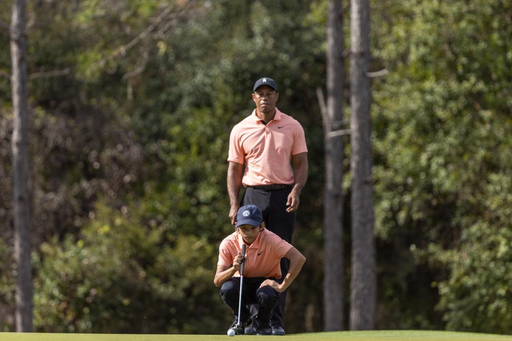 Tiger Woods and Charlie at the PNC Championship