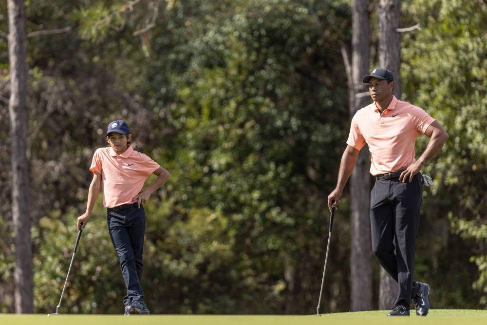 Tiger Woods and Charlie at the PNC Championship